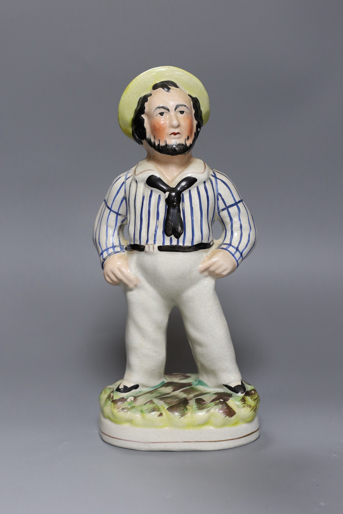 A Staffordshire pottery figure of a sailor, 33 cms high